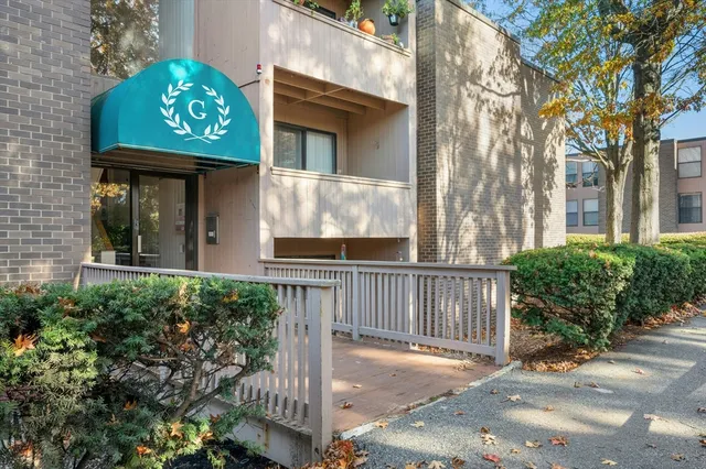 a view of a brick house with a street