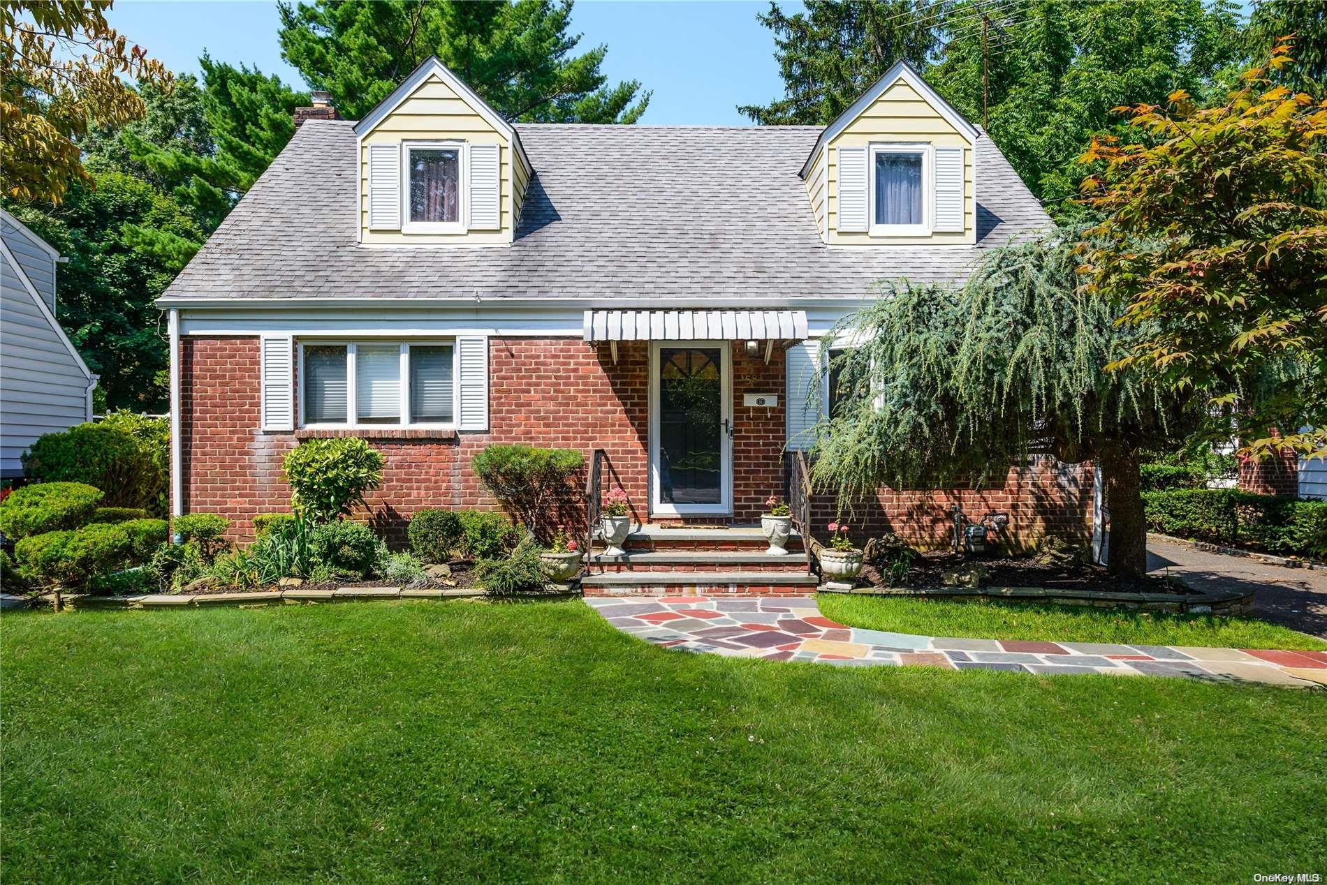 58 Middle Neck Road Port Washington, NY 11050 - Photo 1 of 1 a front view of a house with a yard and fence