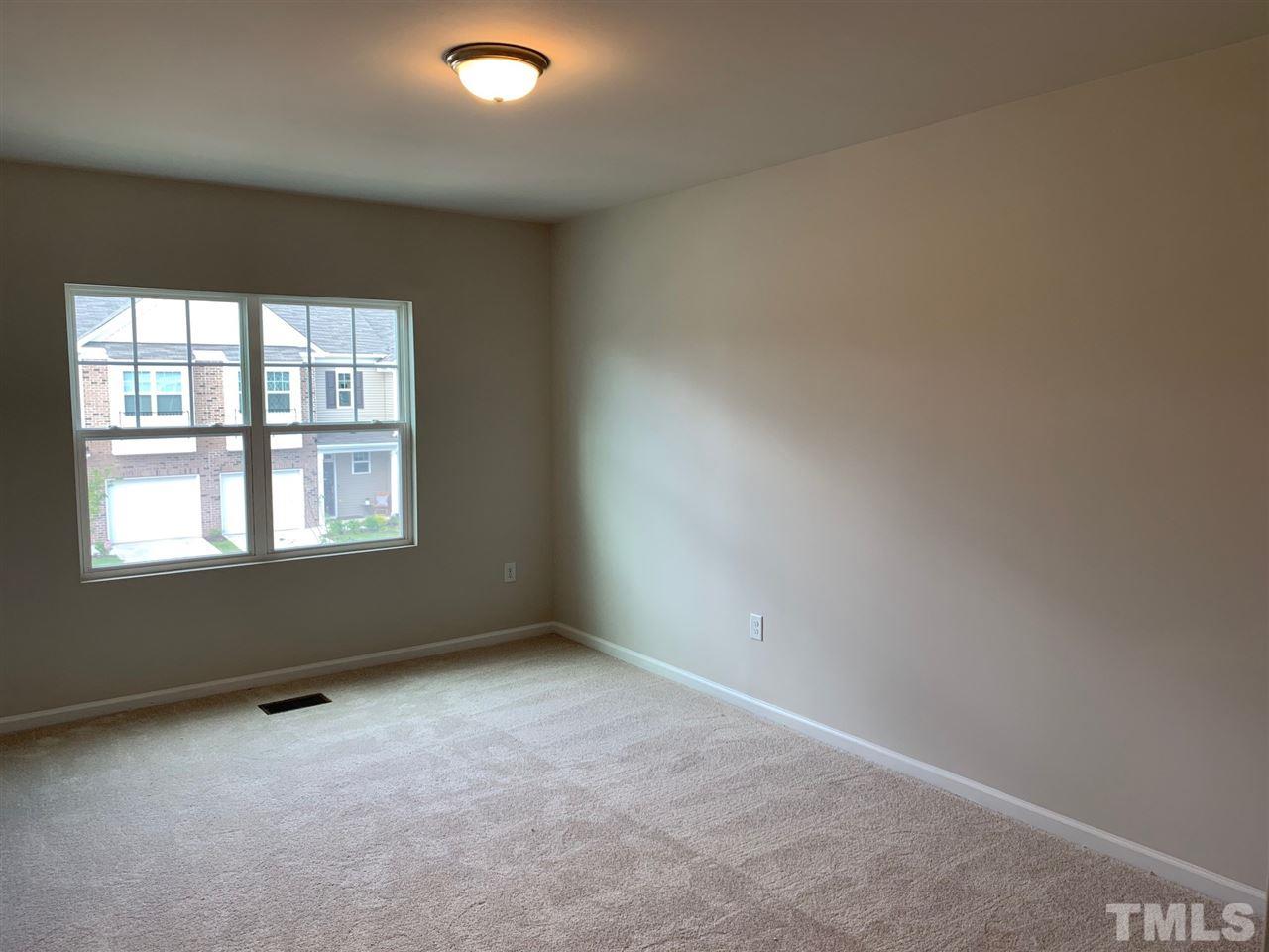 6102 Beale Loop, Unit 104 Raleigh, NC 27616 - Photo 12 of 29 an empty room with a window