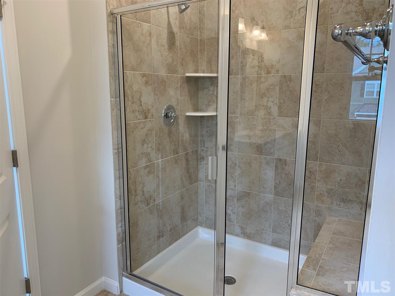 6102 Beale Loop, Unit 104 Raleigh, NC 27616 - Photo 14 of 29 a bathroom with a shower