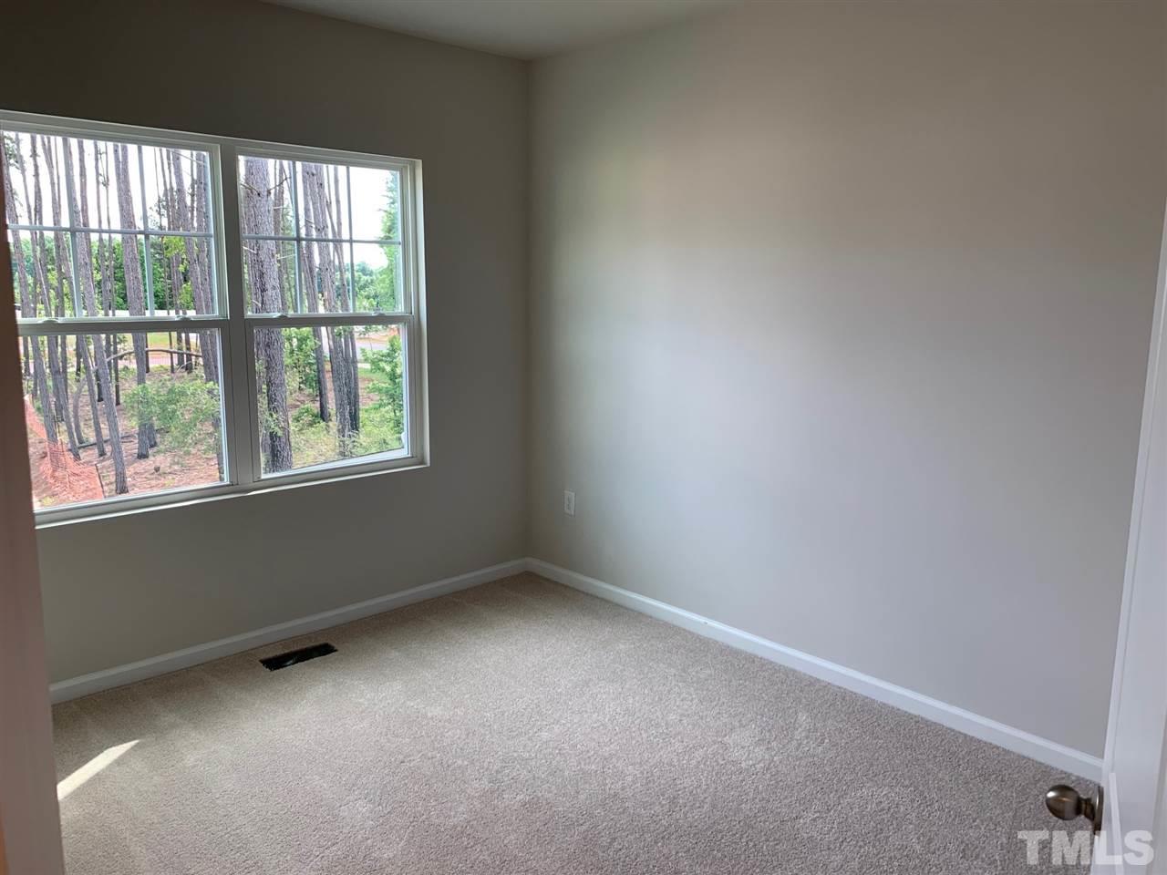 6102 Beale Loop, Unit 104 Raleigh, NC 27616 - Photo 18 of 29 an empty room with a window