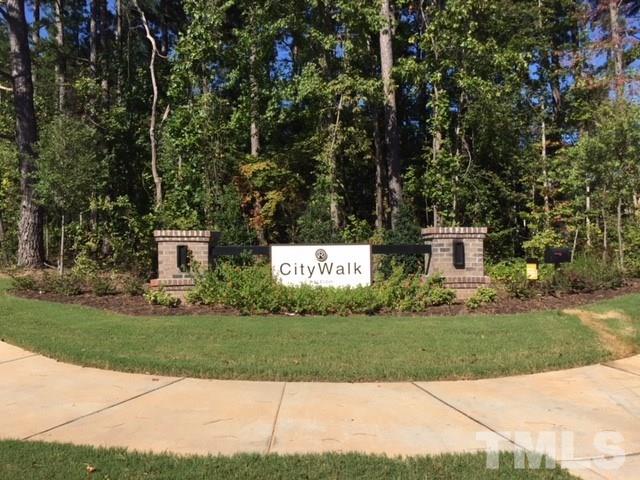 6102 Beale Loop, Unit 104 Raleigh, NC 27616 - Photo 26 of 29 a view of house with a yard and potted plants