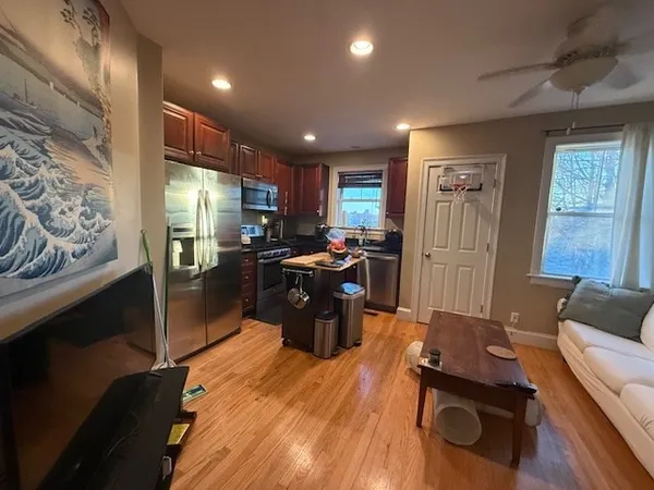 a kitchen with a refrigerator and a sink