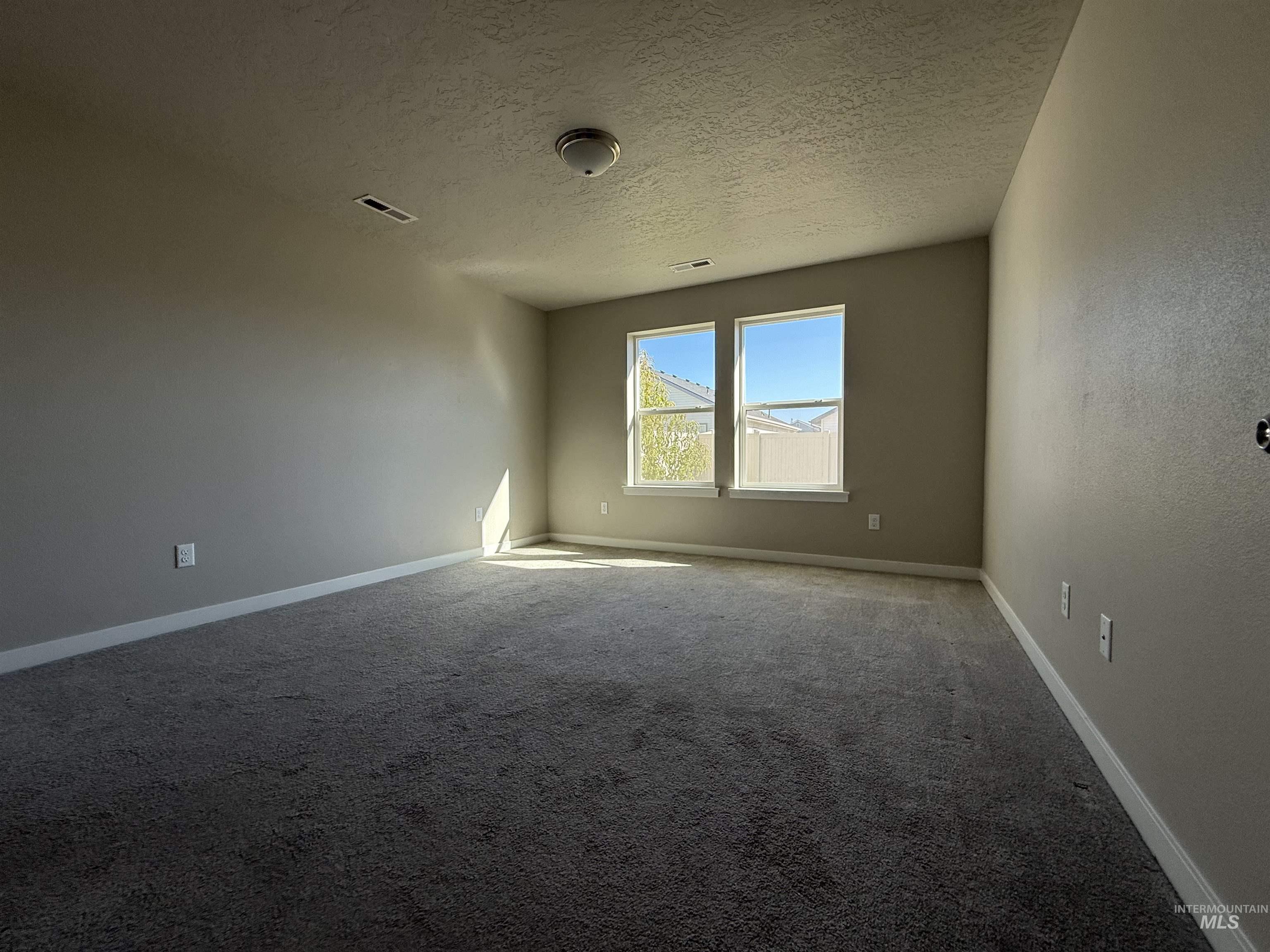 12451 Varga Street Caldwell, ID 83607 - Photo 19 of 30 Bright, spacious room with large dual windows flooding the space with natural light