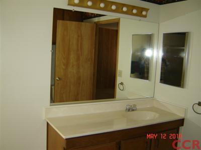 3860 Cherry Hill Road, Unit 136 Santa Maria, CA 93455 - Photo 13 of 14 a bathroom with a sink and a mirror