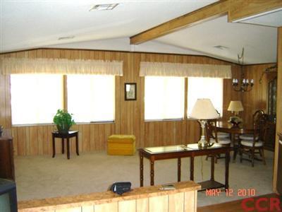 3860 Cherry Hill Road, Unit 136 Santa Maria, CA 93455 - Photo 2 of 14 a living room with furniture and a large window