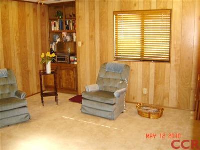 3860 Cherry Hill Road, Unit 136 Santa Maria, CA 93455 - Photo 8 of 14 a living room with furniture and a window