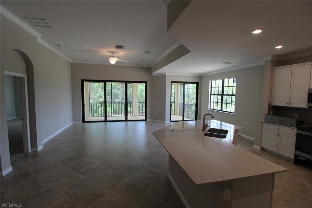 10539 Casella Way, Unit 202 Fort Myers, FL 33913 - Photo 13 of 28 a view of kitchen and windows