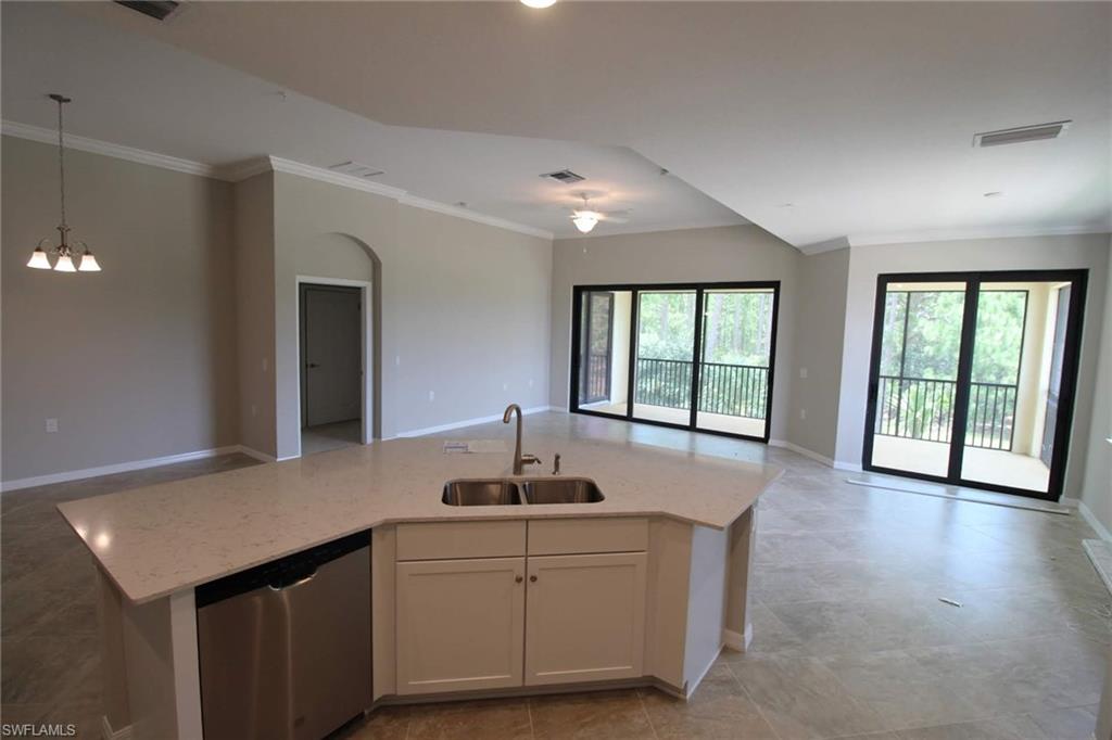 10539 Casella Way, Unit 202 Fort Myers, FL 33913 - Photo 14 of 28 a kitchen with a sink and large window