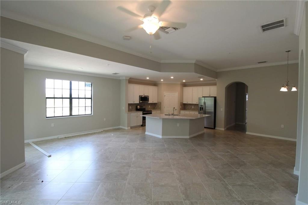 10539 Casella Way, Unit 202 Fort Myers, FL 33913 - Photo 16 of 28 a view of a kitchen with a sink and a window