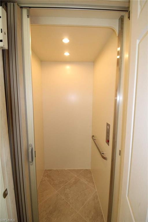 10539 Casella Way, Unit 202 Fort Myers, FL 33913 - Photo 3 of 28 a bathroom with a glass shower door