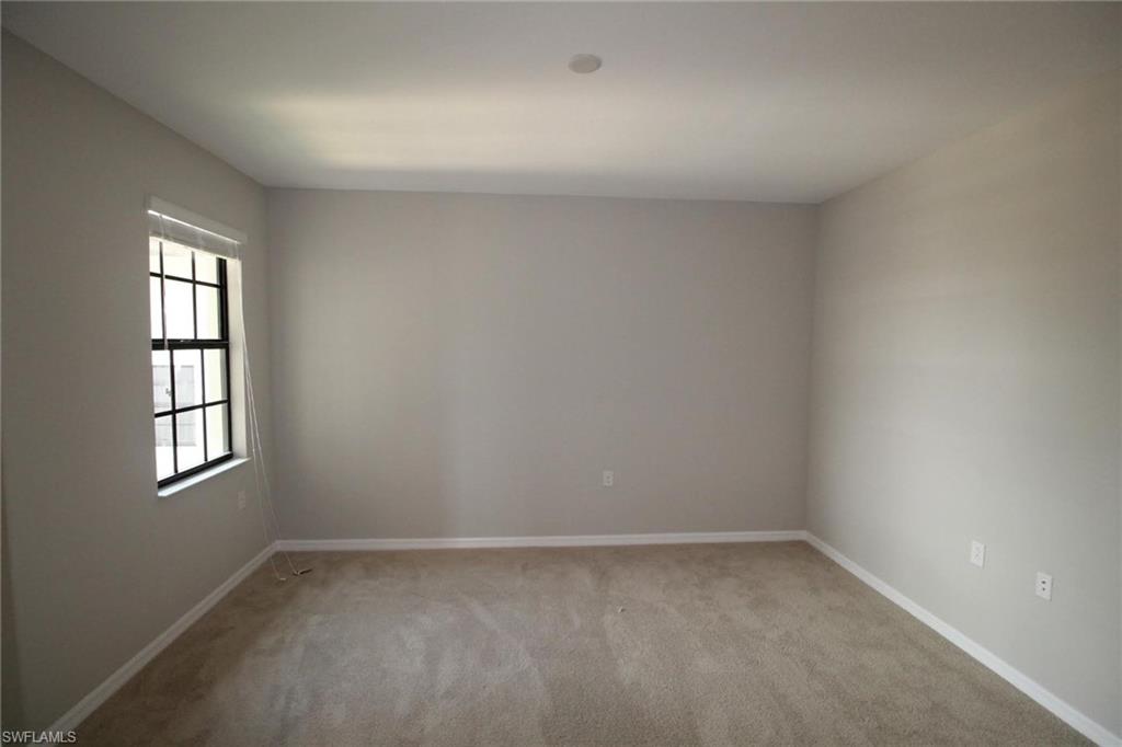 10539 Casella Way, Unit 202 Fort Myers, FL 33913 - Photo 5 of 28 an empty room with a window