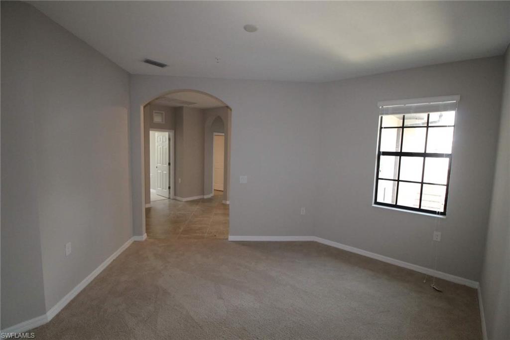 10539 Casella Way, Unit 202 Fort Myers, FL 33913 - Photo 6 of 28 an empty room that has a window