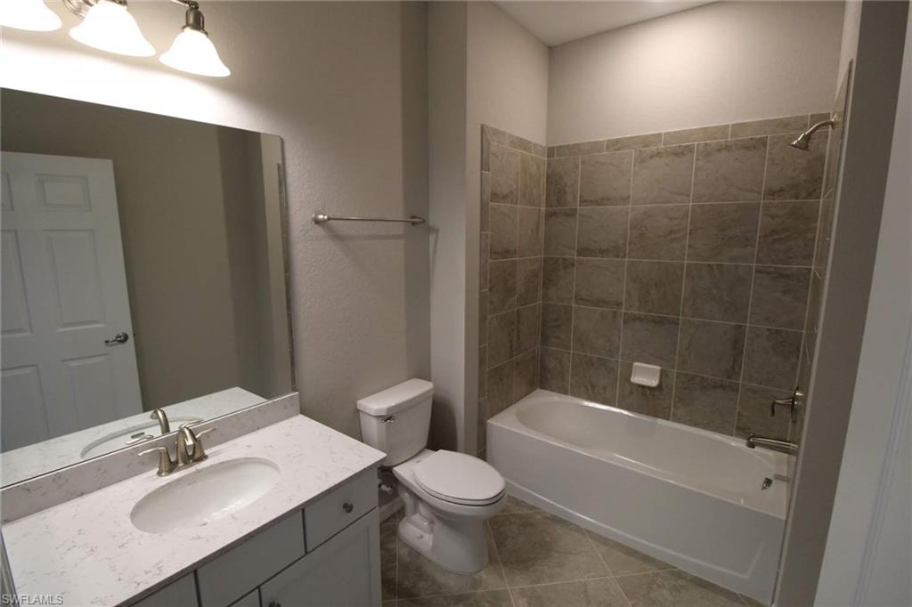 10539 Casella Way, Unit 202 Fort Myers, FL 33913 - Photo 10 of 28 a bathroom with a sink toilet and shower