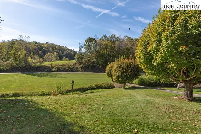 a view of outdoor space with deck and yard