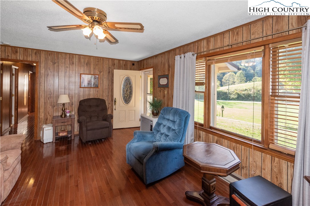 4934 Silas Creek Road Lansing, NC 28643 - Photo 16 of 32 a living room with furniture and a large window