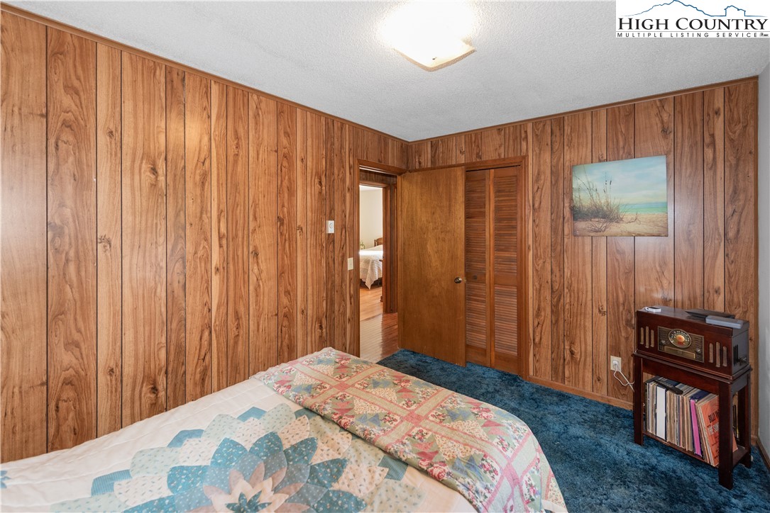 4934 Silas Creek Road Lansing, NC 28643 - Photo 26 of 32 a bedroom with a bed and a closet