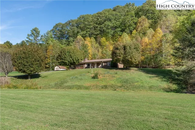 a view of a field with trees