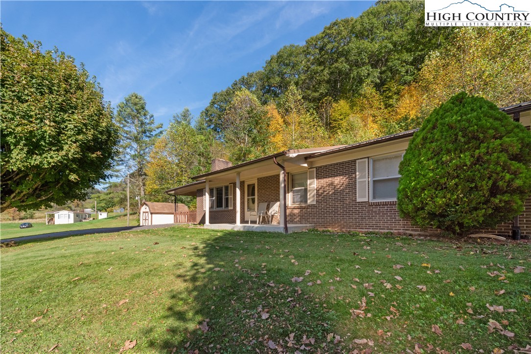 4934 Silas Creek Road Lansing, NC 28643 - Photo 5 of 32 a front view of house with yard and green space