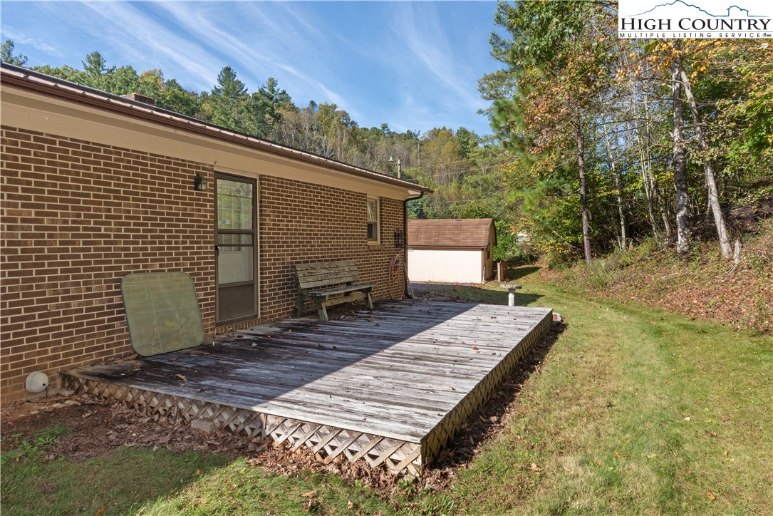 4934 Silas Creek Road Lansing, NC 28643 - Photo 7 of 32 a view of a backyard with chairs