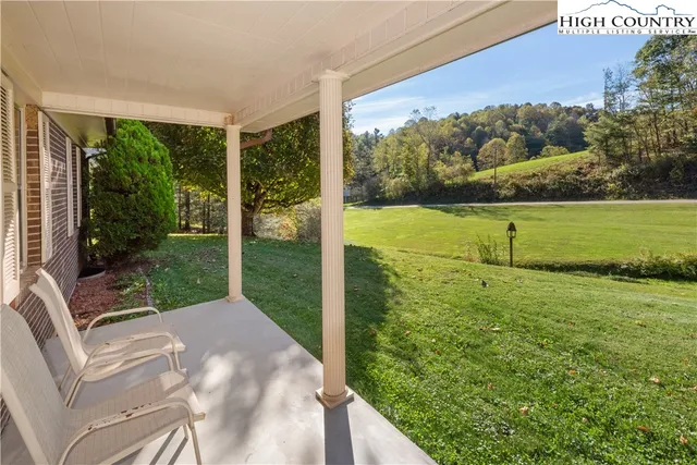 a view of a patio with a yard