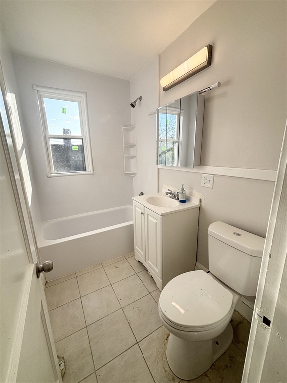 36 Spring Street, Unit 11 Malden, MA 02148 - Photo 11 of 12 a bathroom with a sink toilet and shower