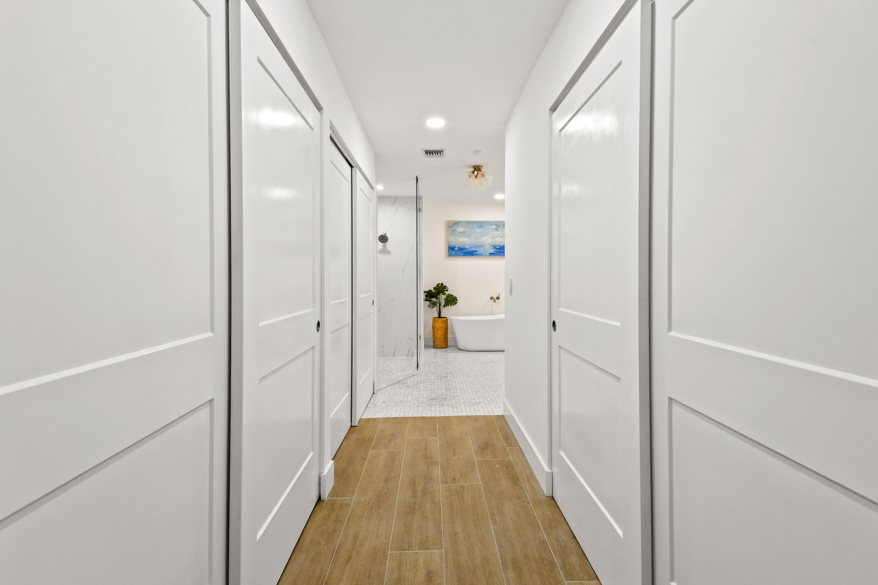 114 Inner Harbour Way Jupiter, FL 33477 - Photo 19 of 38 a view of a hallway with wooden floor