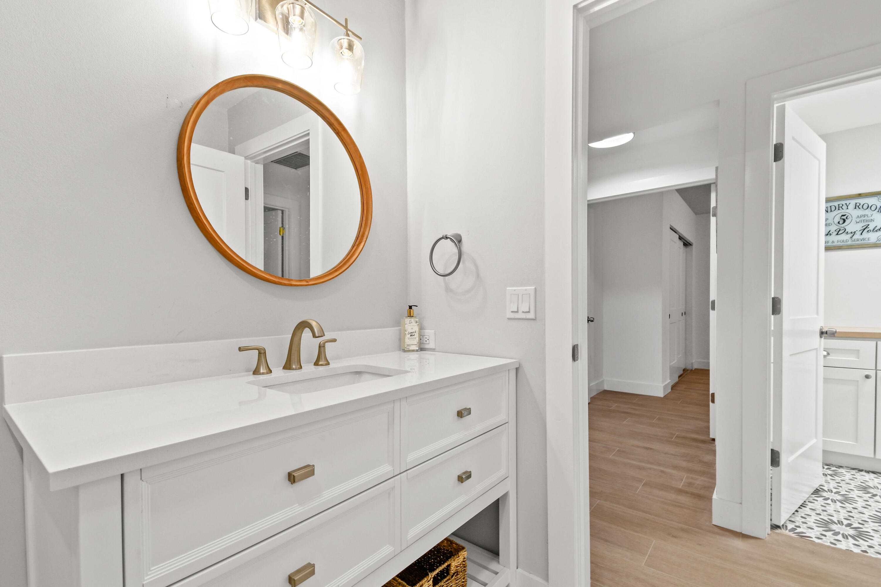 114 Inner Harbour Way Jupiter, FL 33477 - Photo 26 of 38 a bathroom with a sink and a mirror