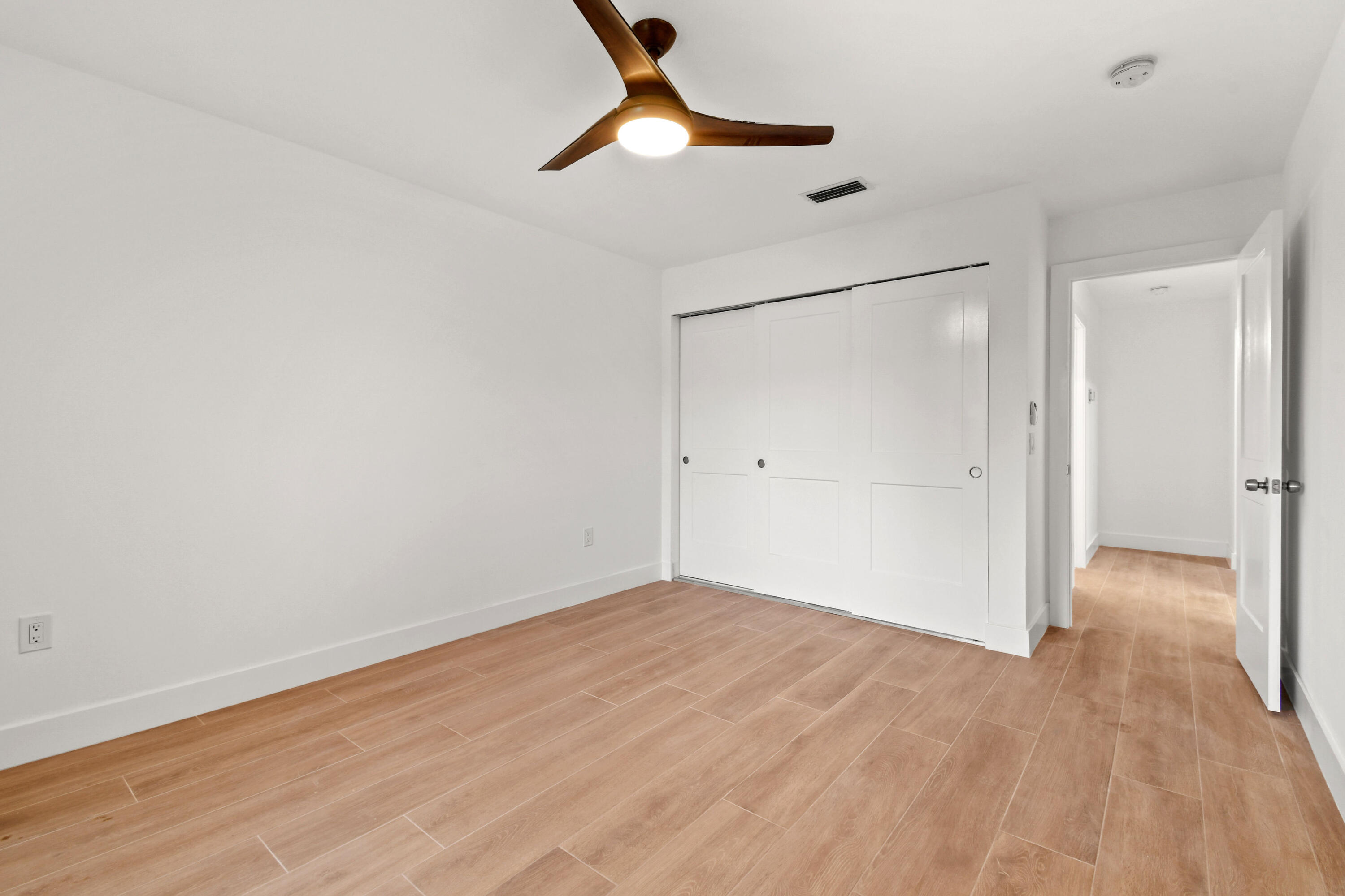 114 Inner Harbour Way Jupiter, FL 33477 - Photo 28 of 38 a view of empty room with wooden floor