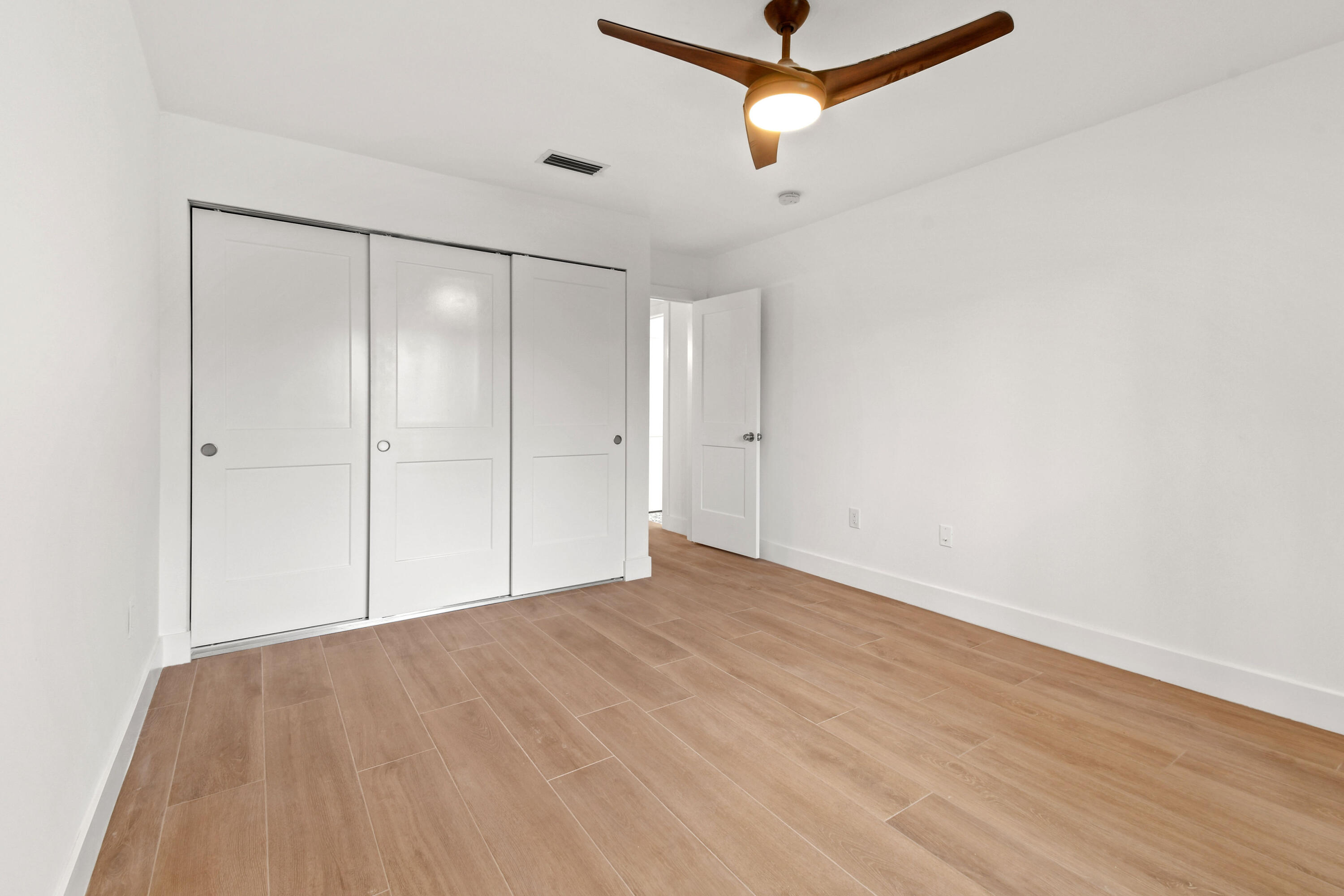 114 Inner Harbour Way Jupiter, FL 33477 - Photo 29 of 38 a view of empty room with wooden floor