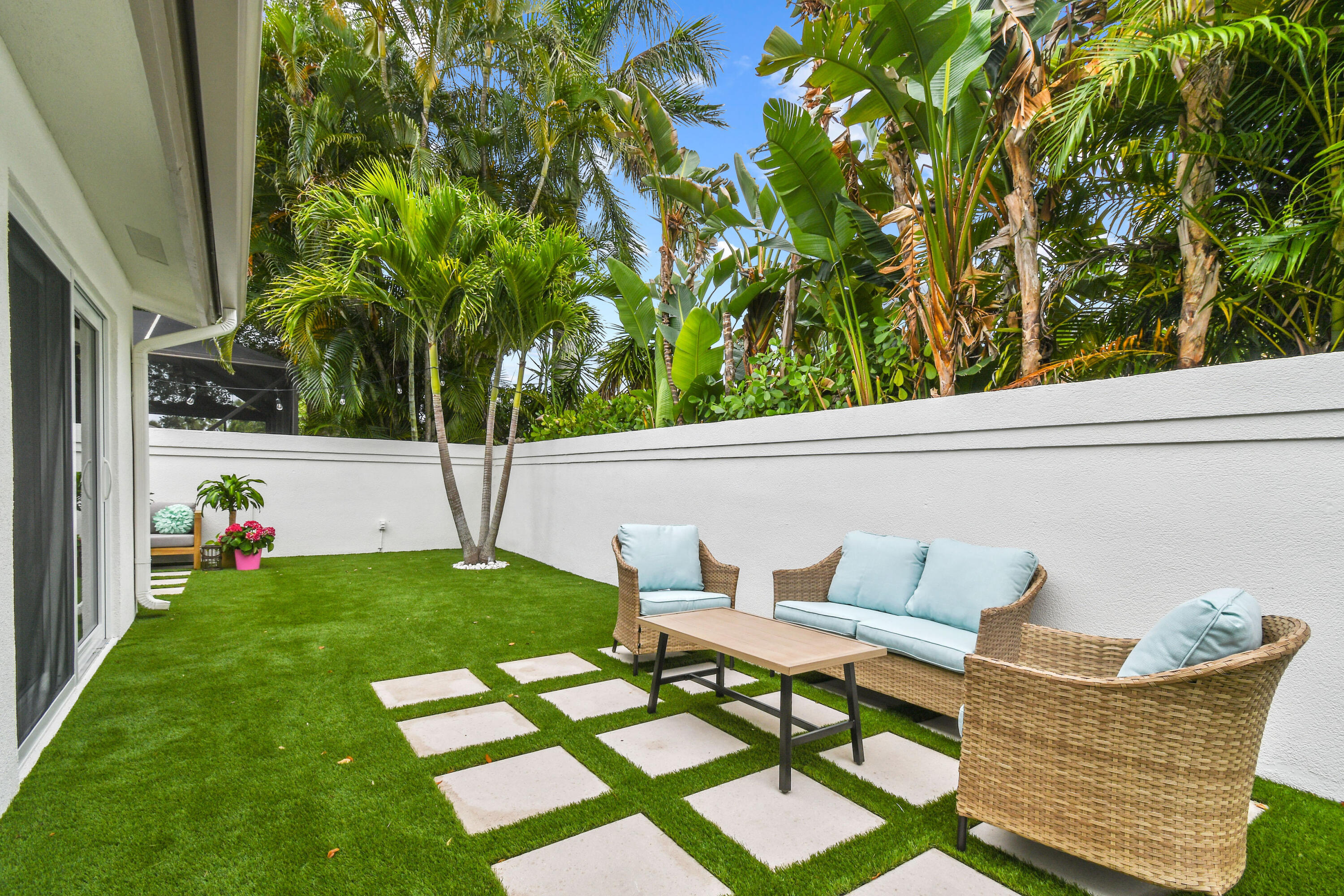 114 Inner Harbour Way Jupiter, FL 33477 - Photo 32 of 38 a view of a chair and table in backyard of the house