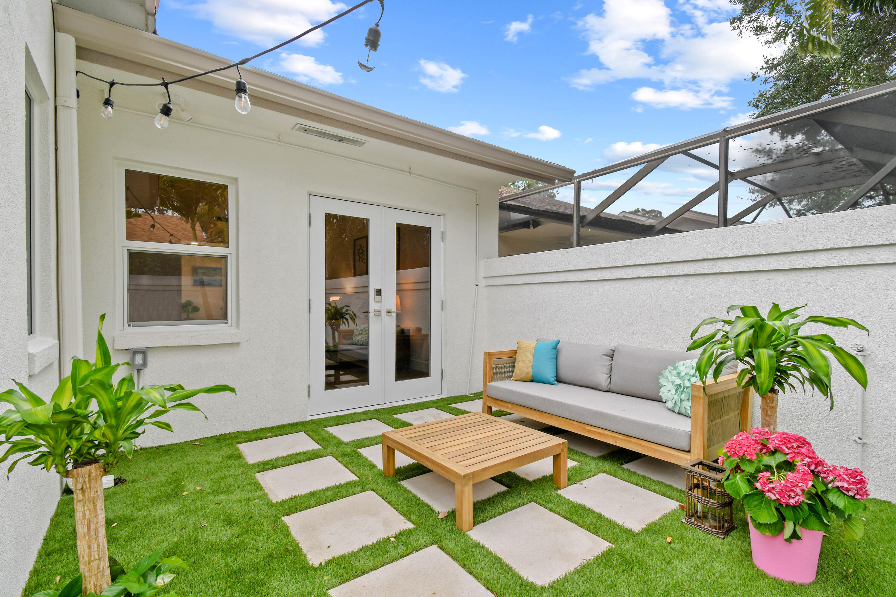 114 Inner Harbour Way Jupiter, FL 33477 - Photo 33 of 38 a patio with couches and potted plants with sky view