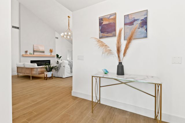 a view of entryway and livingroom with furniture