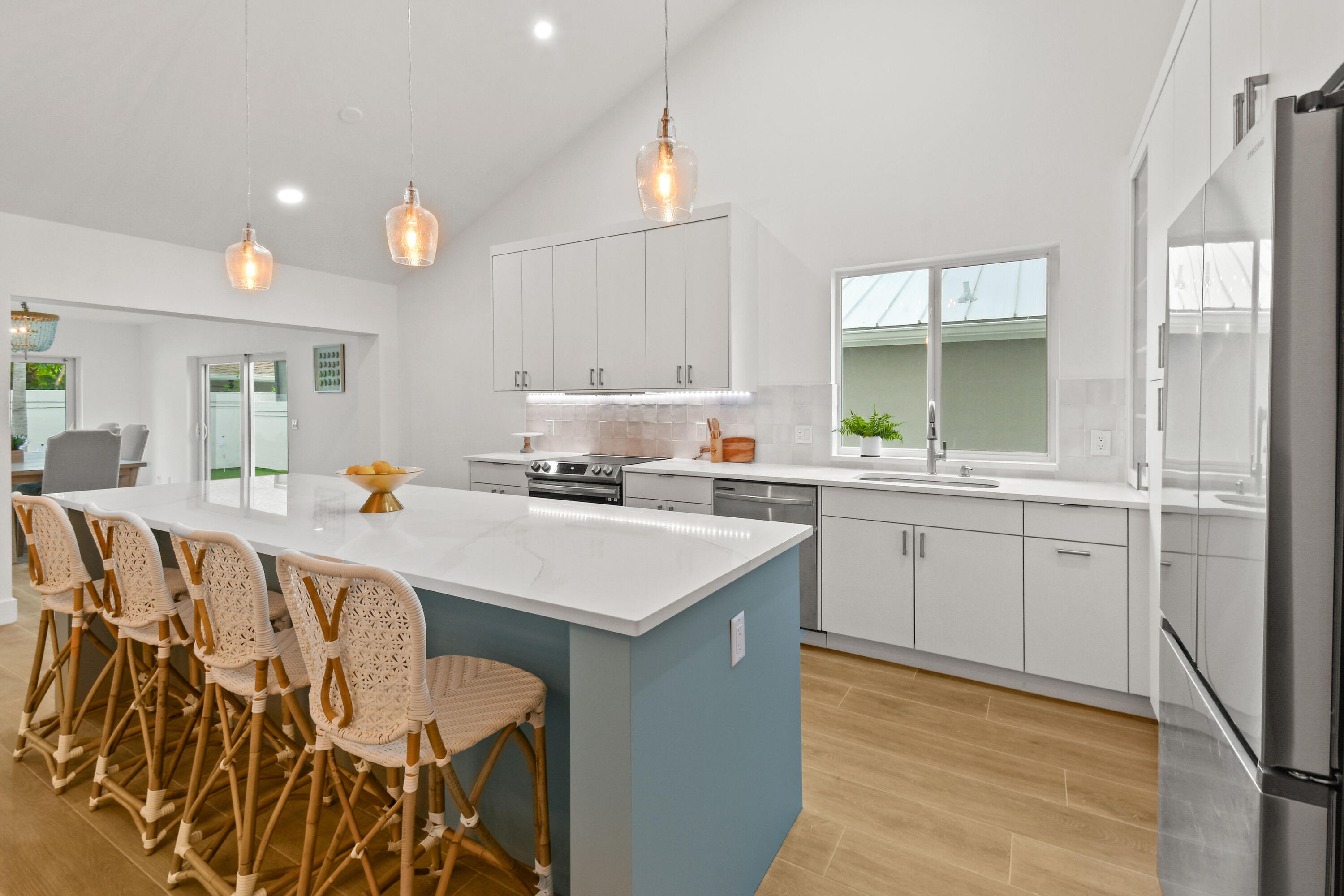 114 Inner Harbour Way Jupiter, FL 33477 - Photo 5 of 38 a kitchen with a sink window and cabinets