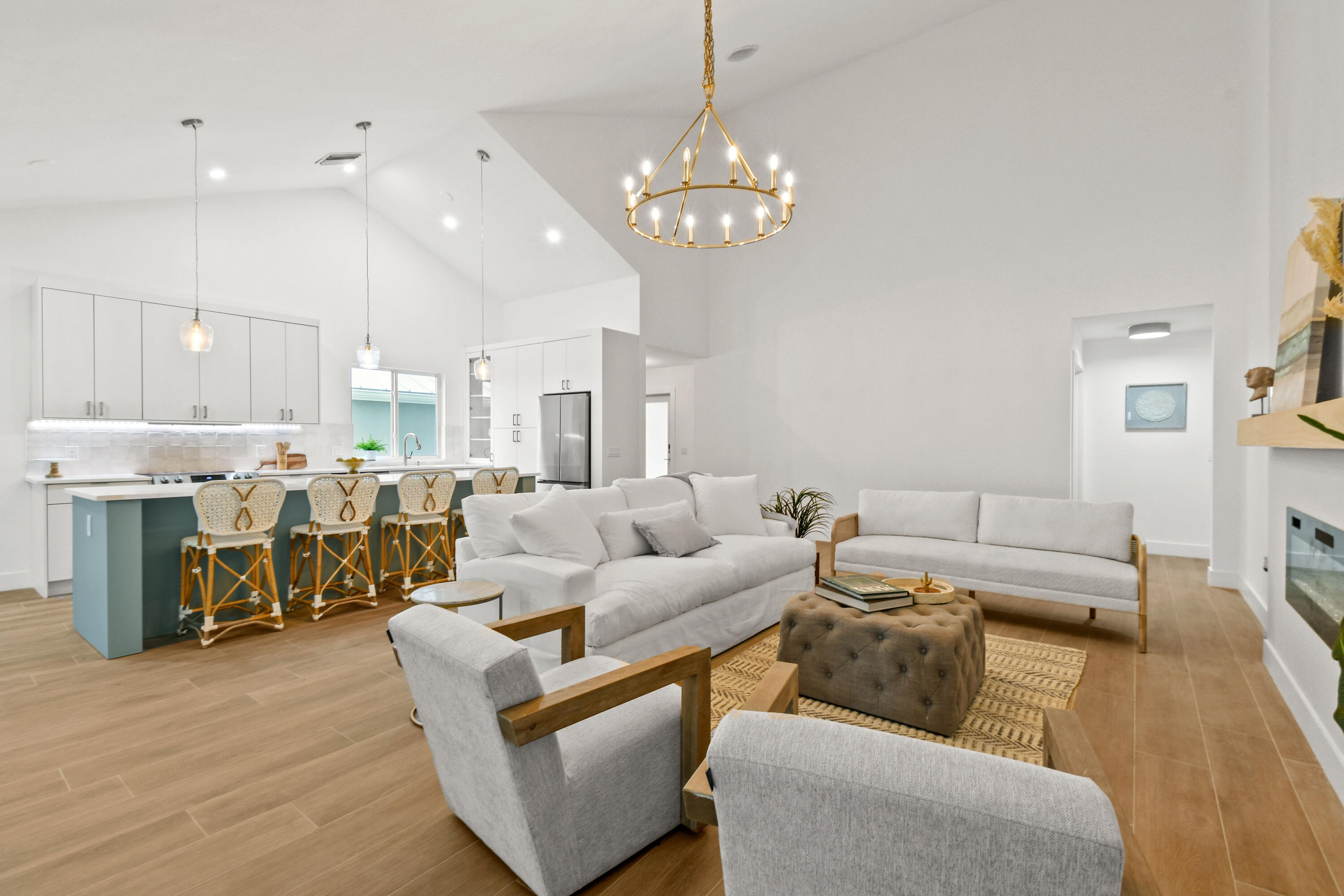 114 Inner Harbour Way Jupiter, FL 33477 - Photo 10 of 38 a living room with furniture and a chandelier