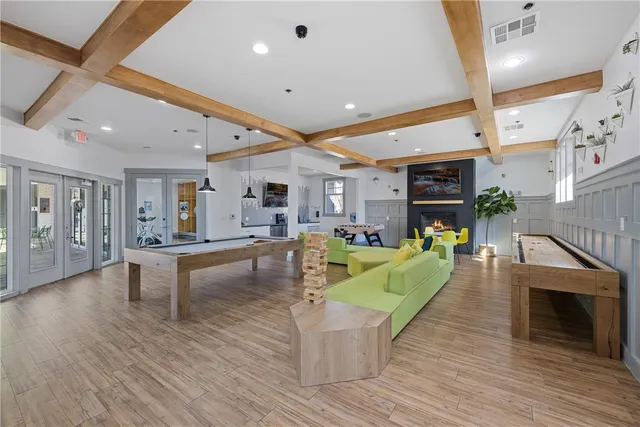 a workspace room with furniture and wooden floor