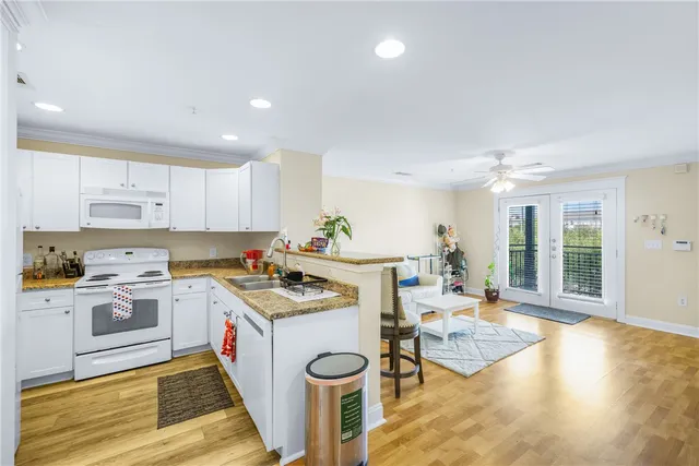 a living room with furniture and a rug