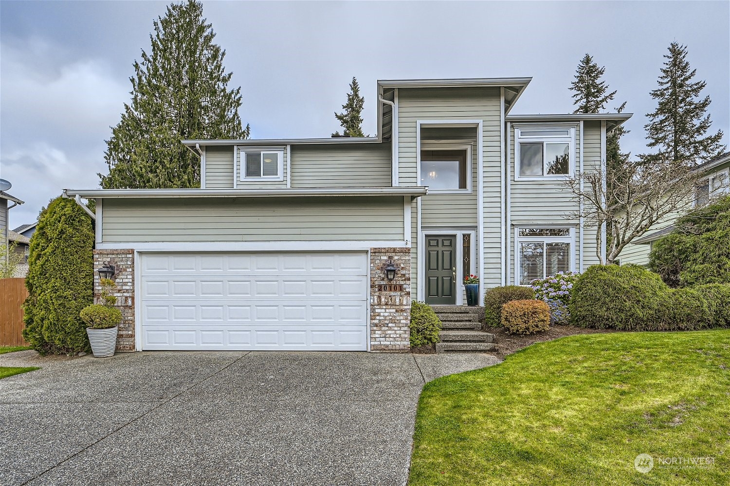 20101 7th Avenue Southeast Bothell, WA 98012 - Photo 1 of 1 a front view of a house with a yard and garage