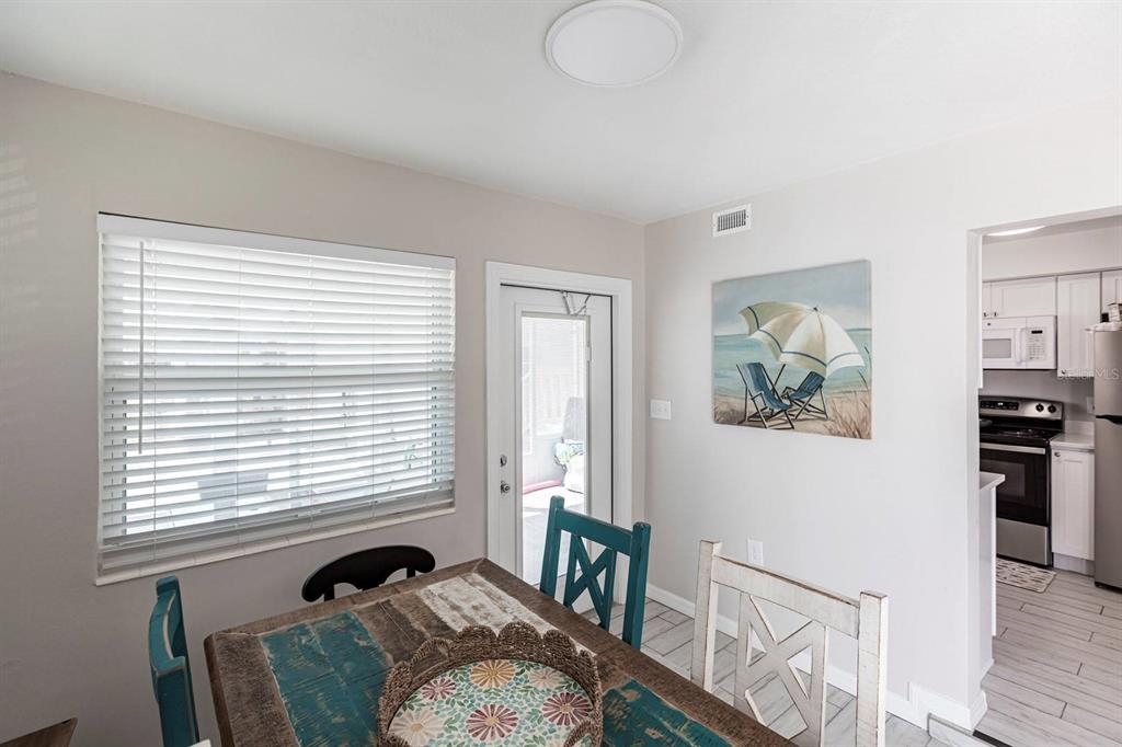 6020 Midnight Pass Road, Unit 52A Sarasota, FL 34242 - Photo 13 of 28 a view of a livingroom with furniture and windows
