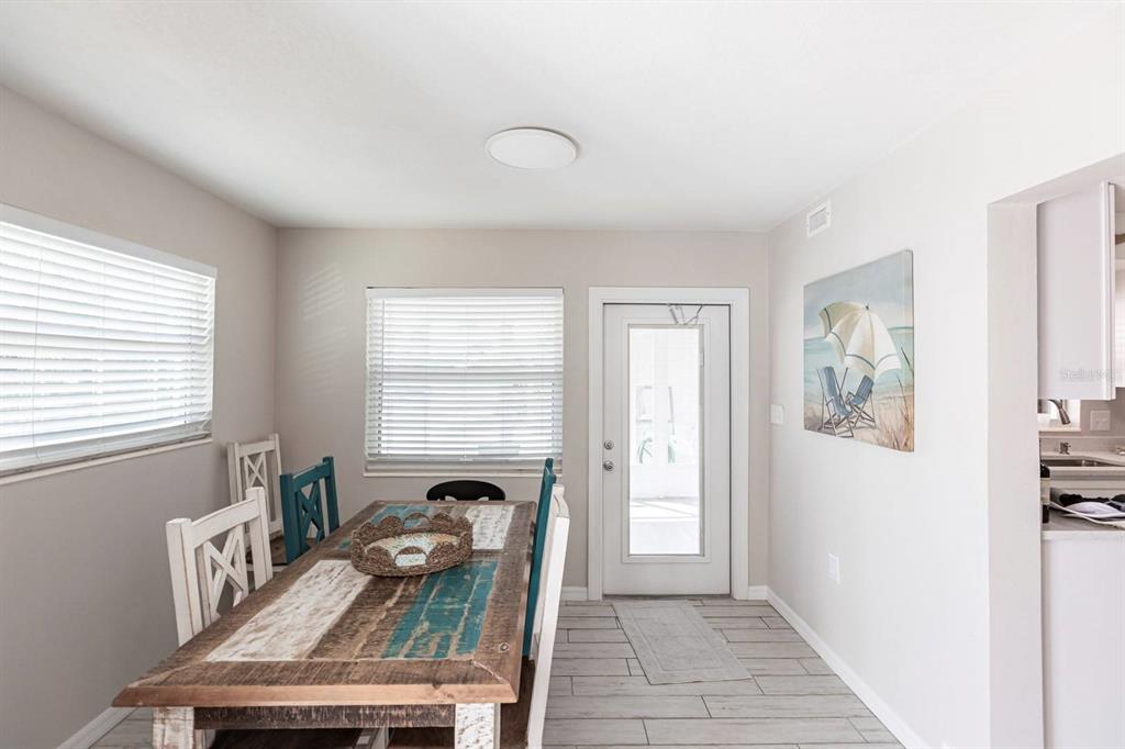 6020 Midnight Pass Road, Unit 52A Sarasota, FL 34242 - Photo 21 of 28 a living room with furniture and a window