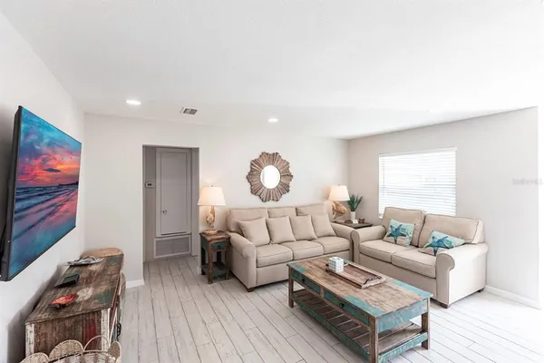 a living room with furniture and a window