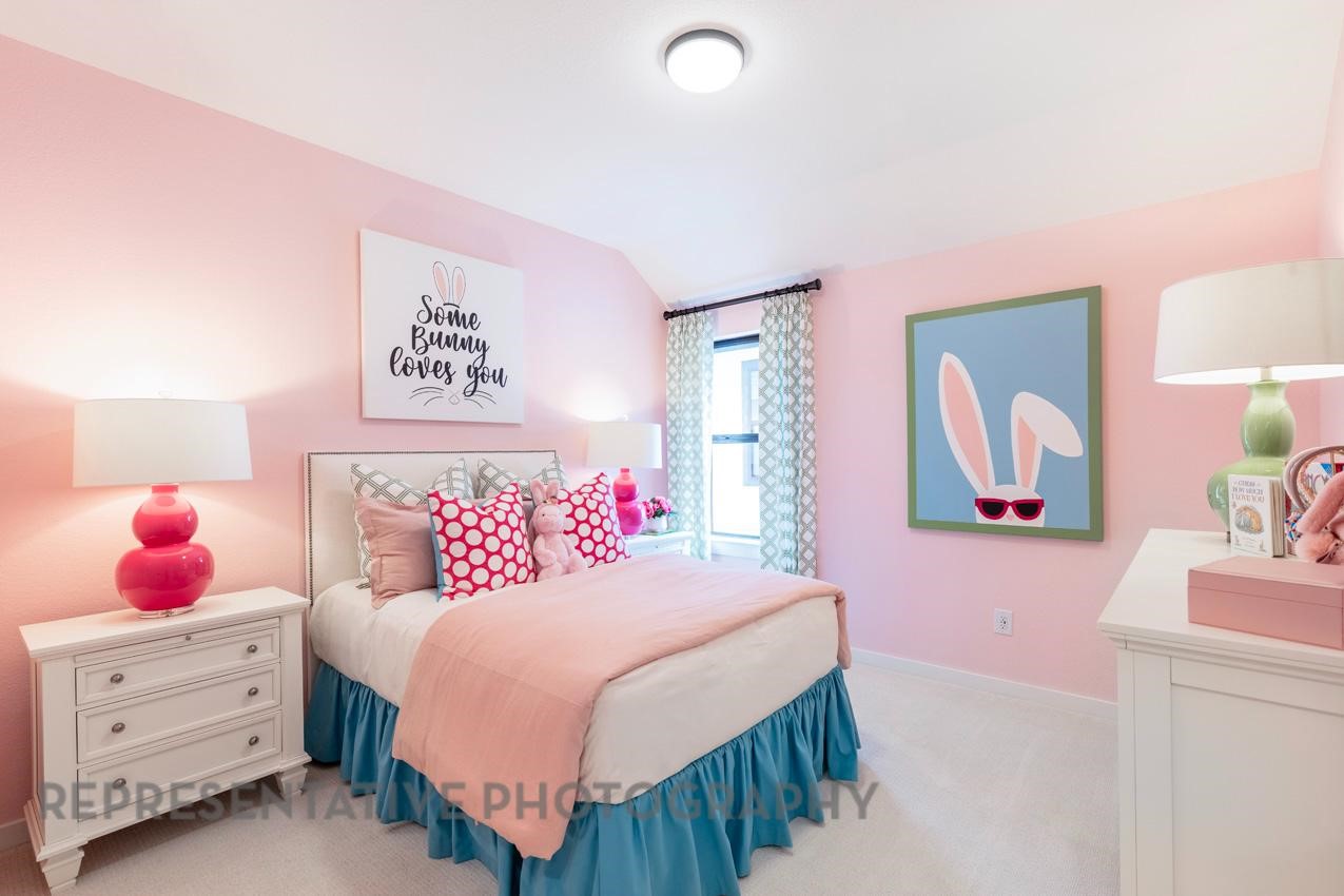 5310 Murillo Drive Manvel, TX 77578 - Photo 14 of 20 a bedroom with a bed a lamp and wall painting