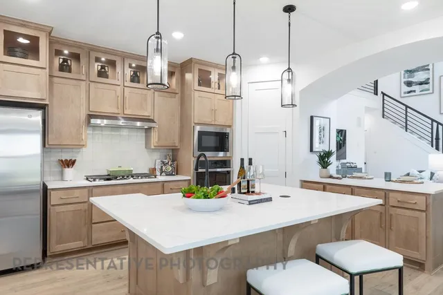 a kitchen with a counter a sink and cabinets