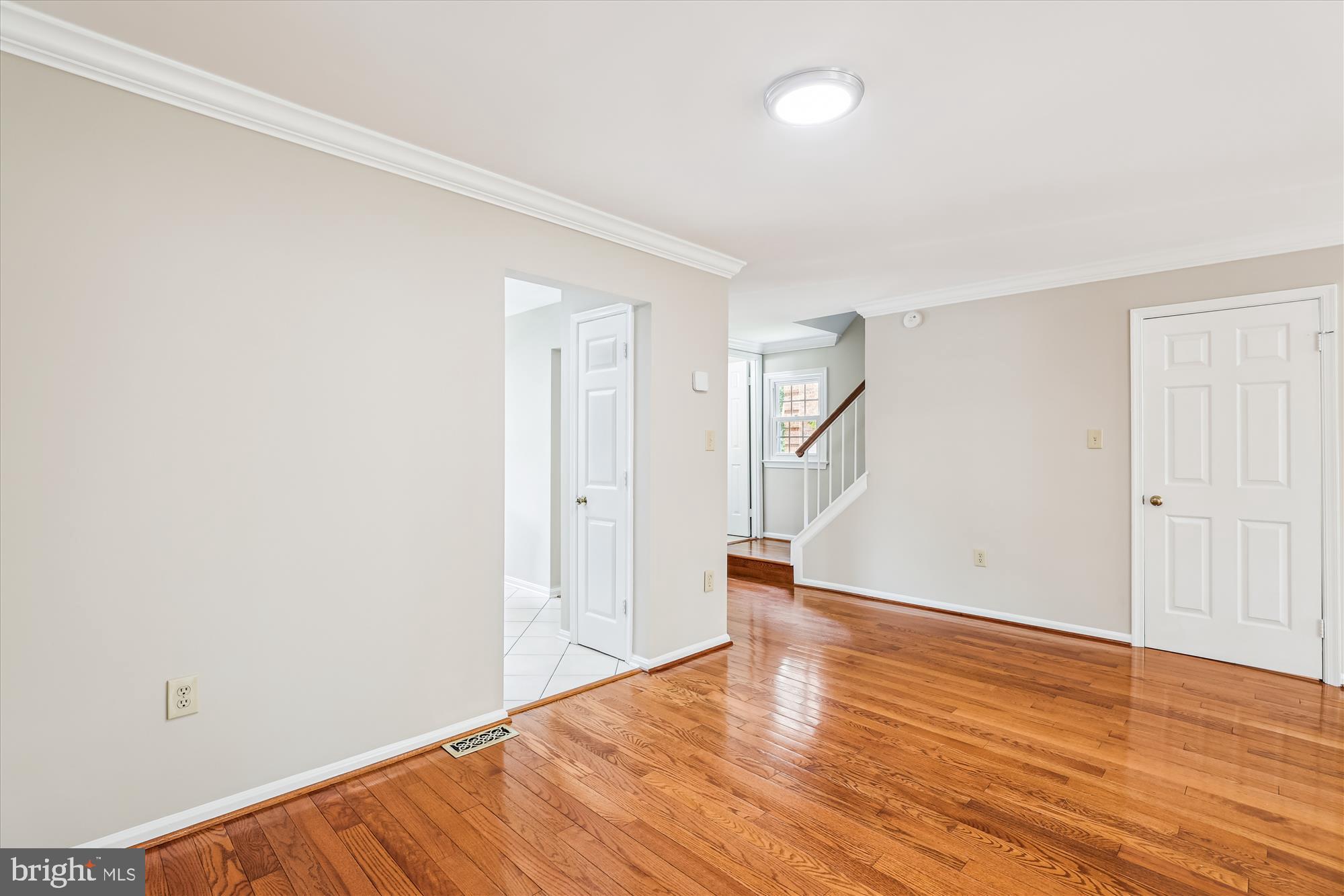 7708 Shootingstar Drive Springfield, VA 22152 - Photo 11 of 62 a view of an empty room with wooden floor and a window
