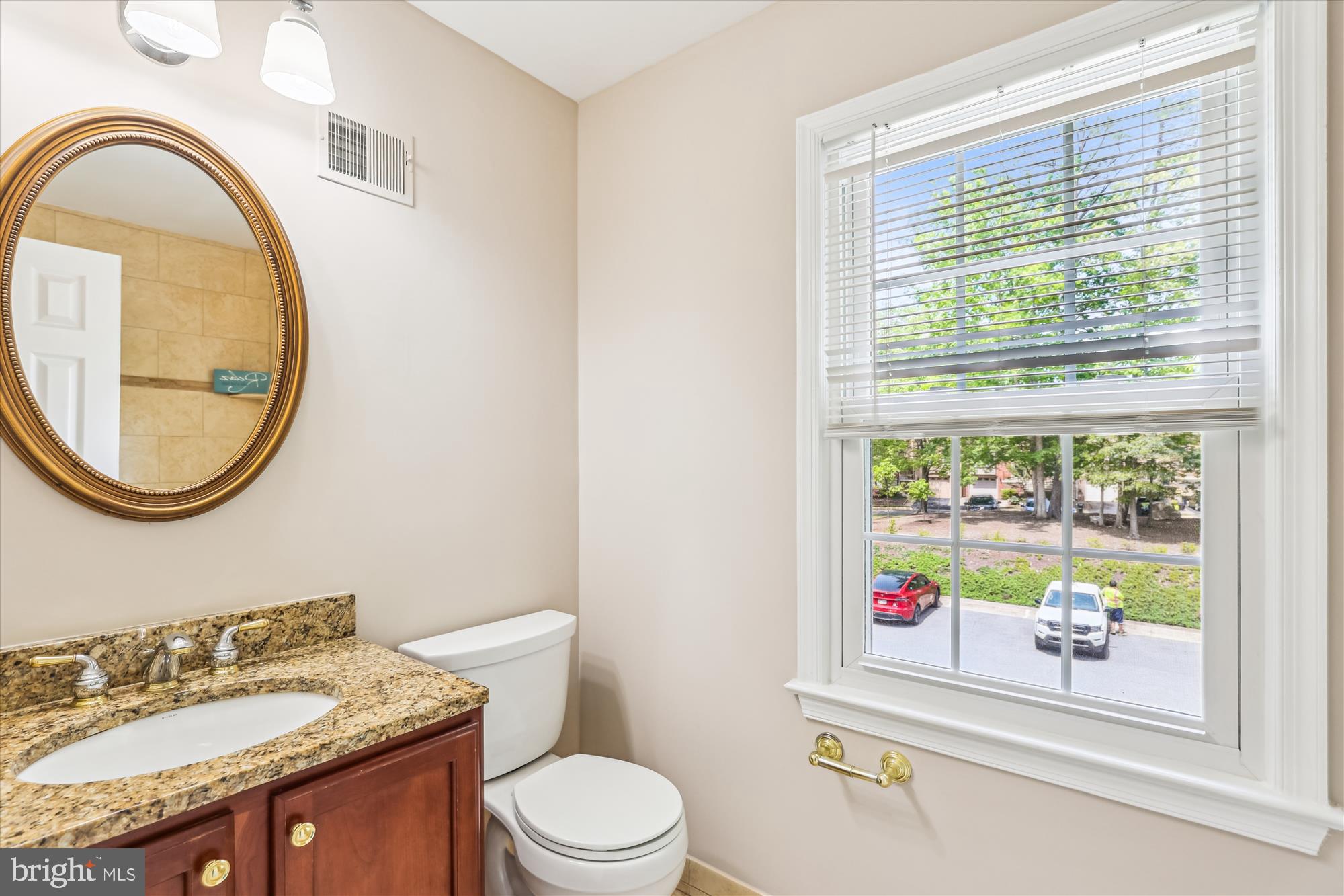 7708 Shootingstar Drive Springfield, VA 22152 - Photo 26 of 62 a bathroom with a toilet a sink and a mirror