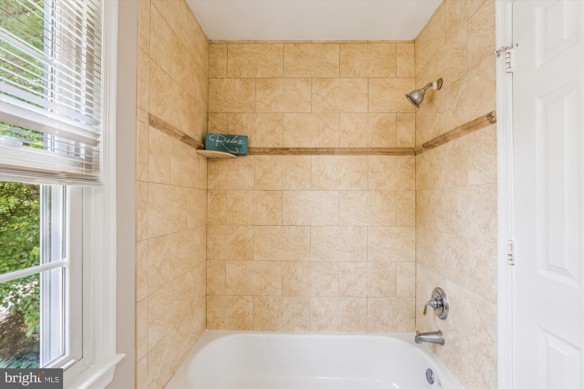 7708 Shootingstar Drive Springfield, VA 22152 - Photo 27 of 62 a bathroom with a shower and a bathtub