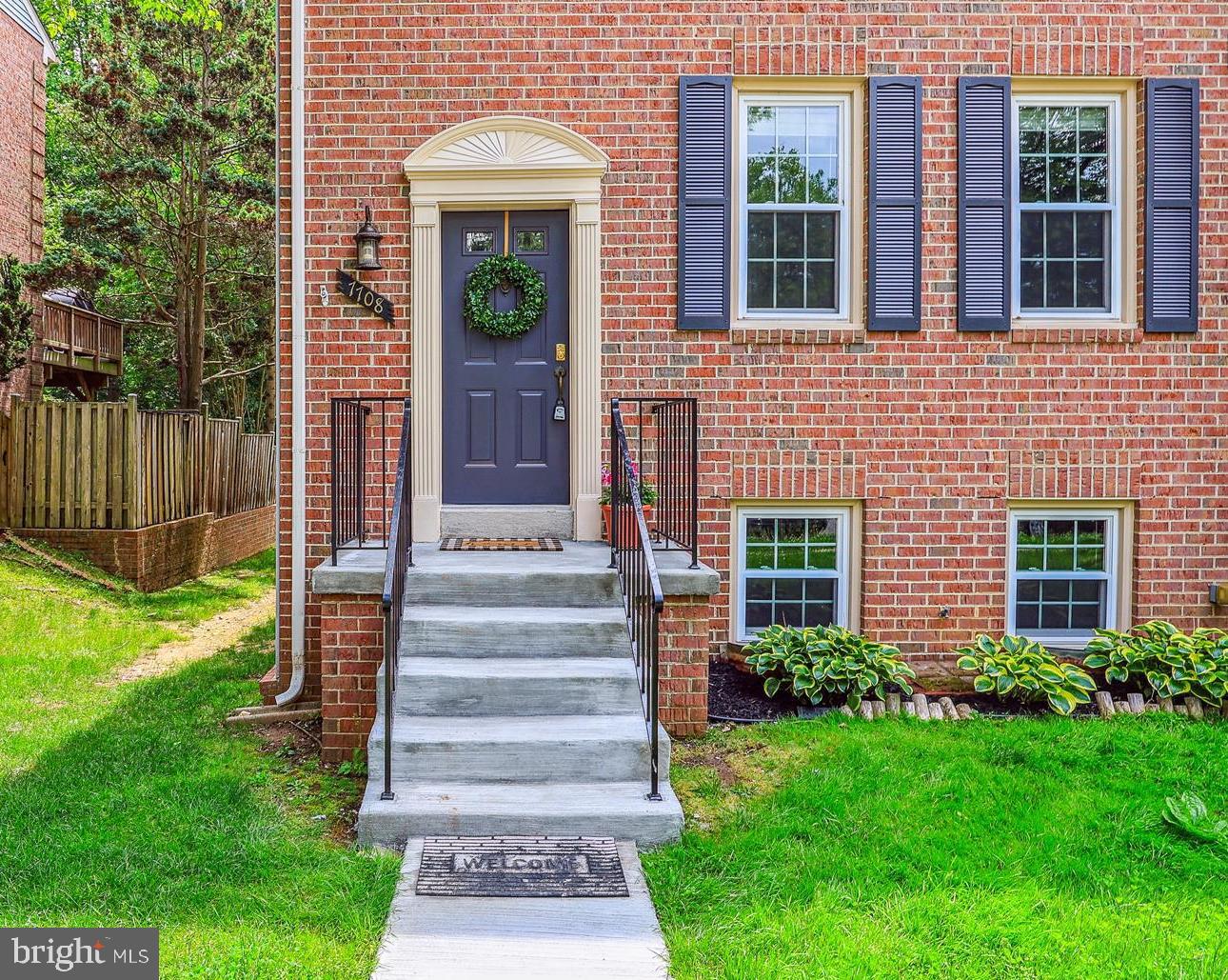 7708 Shootingstar Drive Springfield, VA 22152 - Photo 3 of 62 a front view of a house with garden