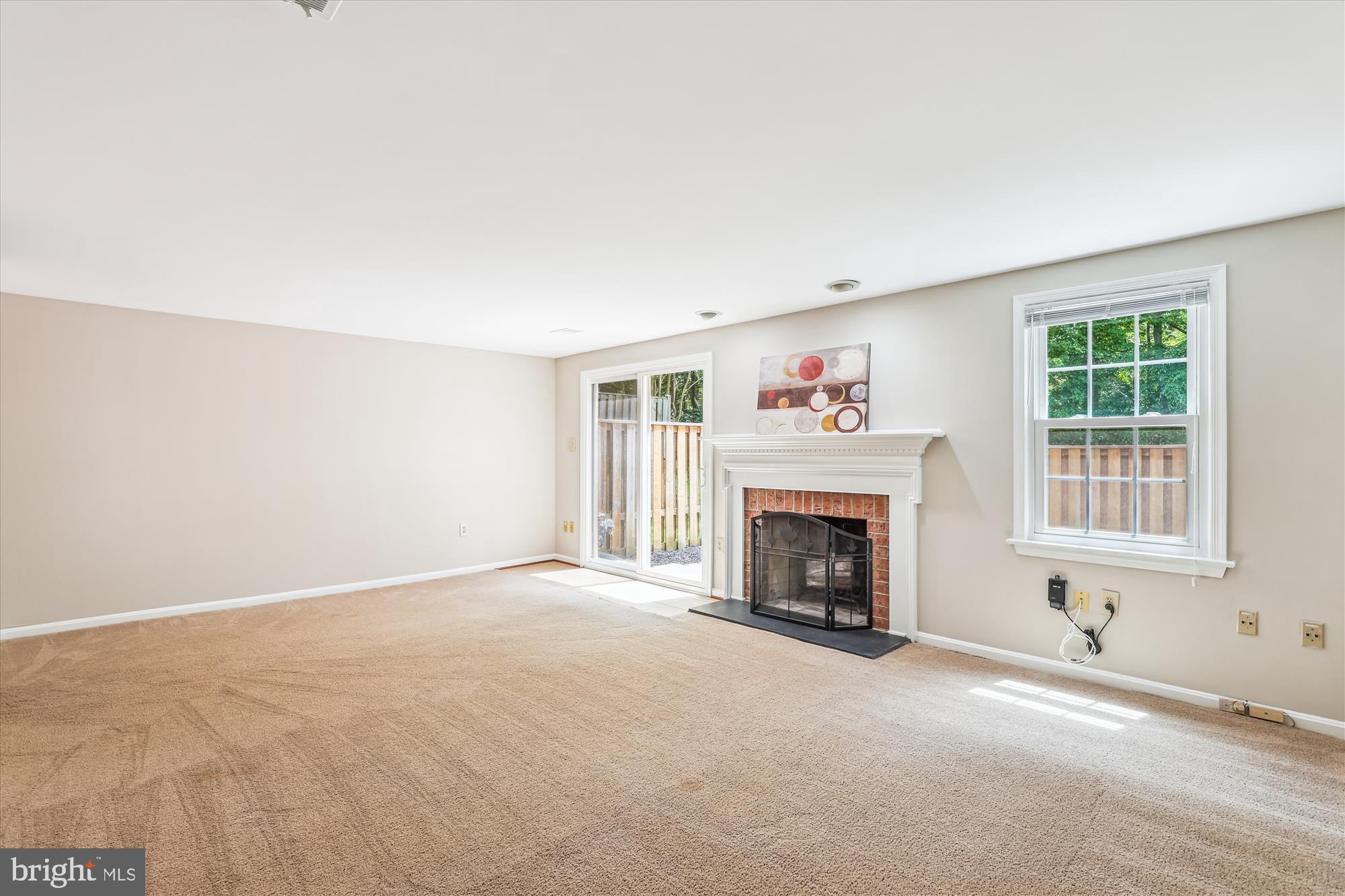 7708 Shootingstar Drive Springfield, VA 22152 - Photo 35 of 62 an empty room with fireplace and windows