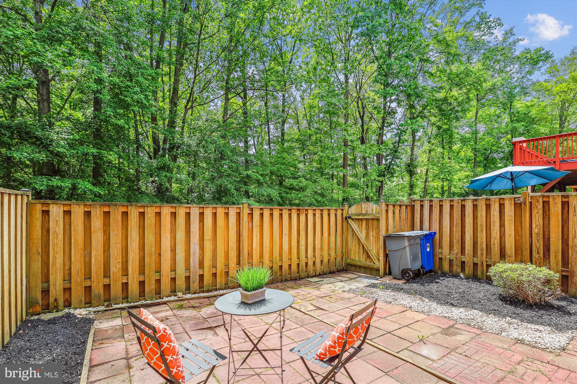 7708 Shootingstar Drive Springfield, VA 22152 - Photo 43 of 62 a backyard of a house with dining table and chairs