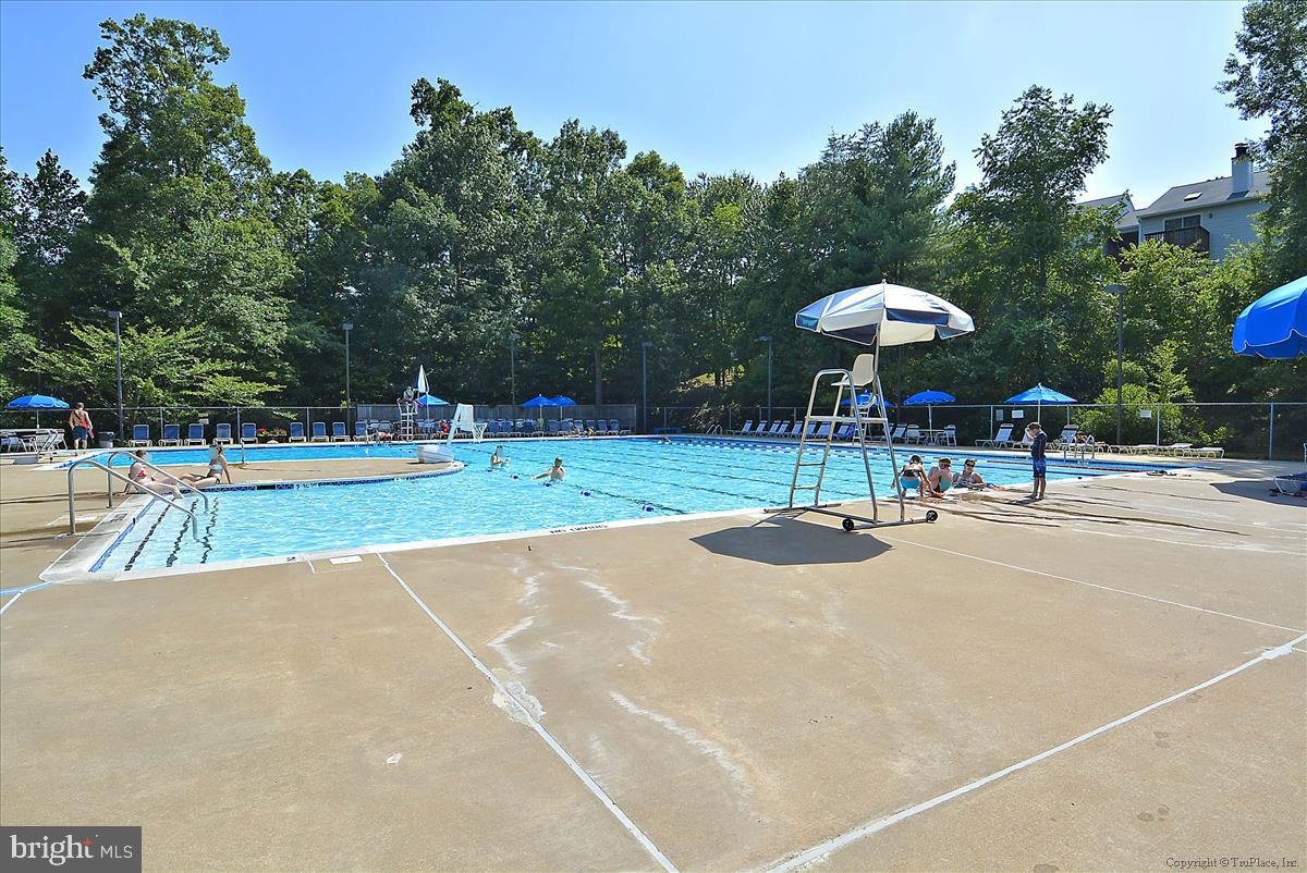 7708 Shootingstar Drive Springfield, VA 22152 - Photo 52 of 62 a swimming pool with an outdoor space and seating area